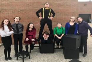 A group of people posing for a photo
Description automatically generated
