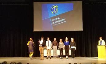 A group of people posing for a photo
Description automatically generated
